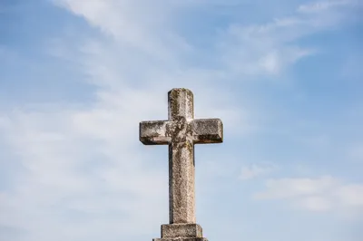 Empty Stone Cross Under Blue Sky