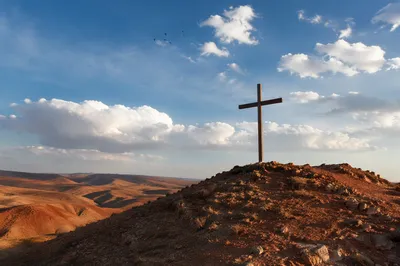 Empty Wooden Cross Beneath Blue Sky