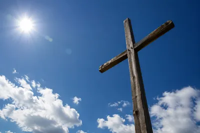 Empty Wooden Cross Under Blue Sky