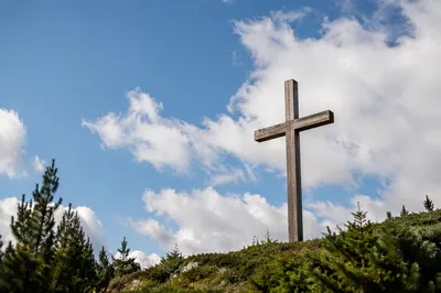 Wooden Cross Beneath Blue Clouded Sky
