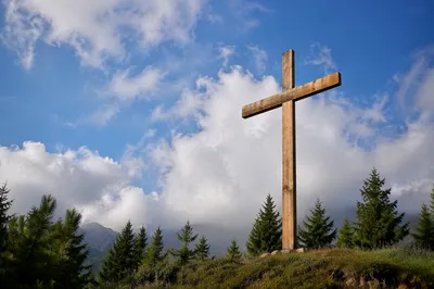 Empty Wooden Cross Under Blue Sky