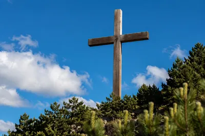 Empty Wooden Cross Beneath Blue Sky