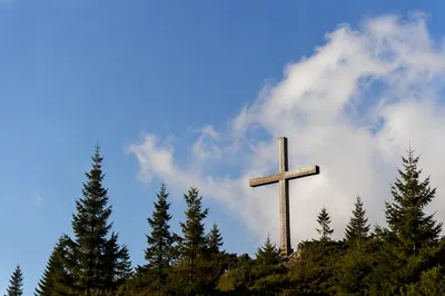 Empty Wooden Cross Beneath Blue Sky