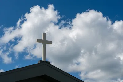 White Cross Beneath Blue Clouded Sky