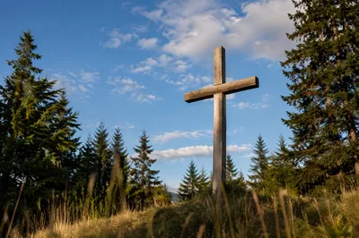 Empty Wooden Cross Under Blue Morning Sky