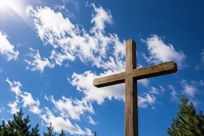 Empty Wooden Cross Under Blue Sky