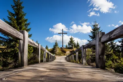 Empty Wooden Cross Beneath Blue Sky