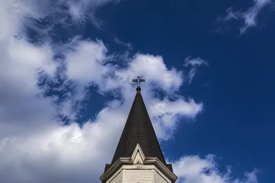Empty Cross Steeple Under Blue Sky
