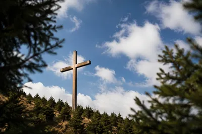 Empty Wooden Cross Under Blue Sky