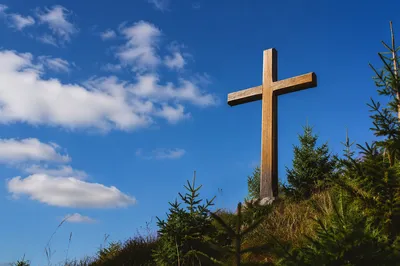 Empty Wooden Cross Beneath Blue Sky