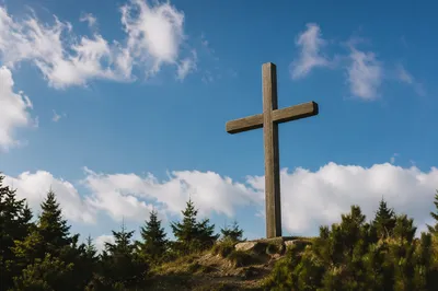 Empty Wooden Cross Under Blue Sky