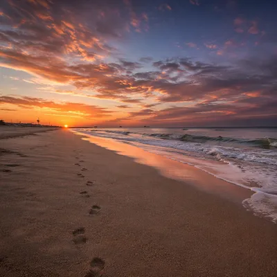 Footprints on Sunrise Beach Horizon
