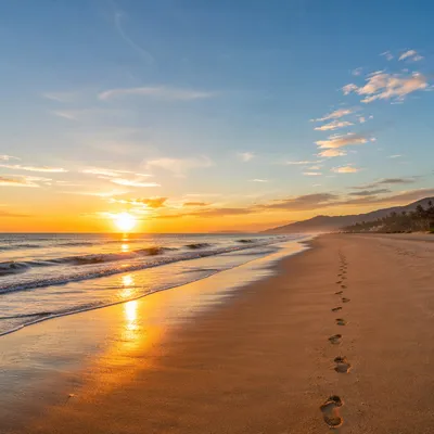 Footprints on Peaceful Sunrise Beach