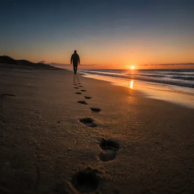 Footprints Toward Sunrise on Quiet Beach