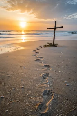 Footprints to Driftwood Cross at Sunrise