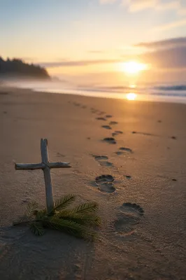 Footprints to Sunrise with Driftwood Cross
