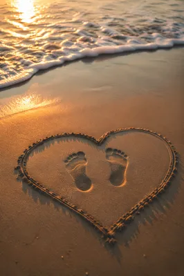 Footprints in Sand at Sunrise Heart