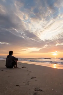 Footprints on Sunrise Beach at Dawn