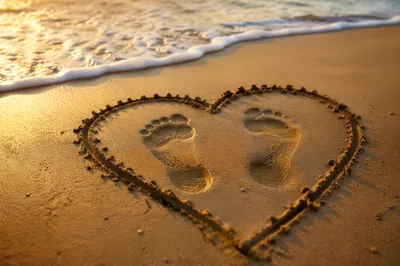 Footprints in Sand Heart at Sunrise