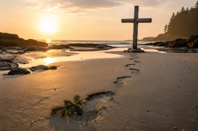 Footprints Toward Cross at Beach Sunrise