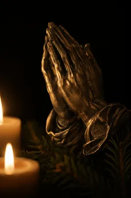 Candlelit Praying Hands with Evergreen Shadows