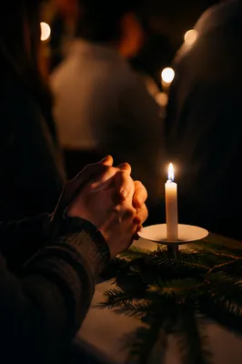 Candlelit Folded Hands in Winter Prayer