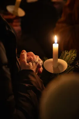Folded Prayer Hands by Candlelight