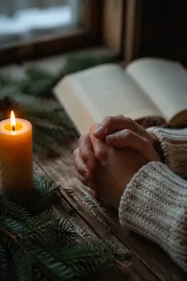 Folded Prayer Hands by Candlelight