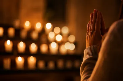 Candlelit Hands Folded in Quiet Prayer
