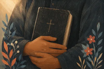 Reverent Hands Holding Worn Black Bible