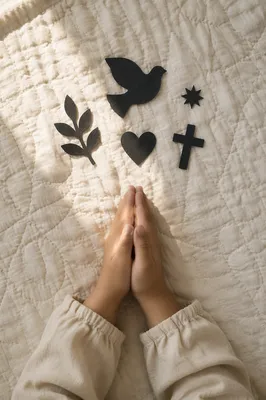 Child Praying Hands on Soft Quilt