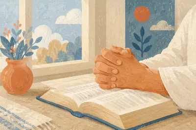 Praying Hands on Open Book in Soft Light