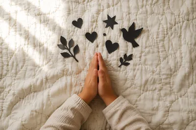 Child Hands Praying in Soft Natural Light