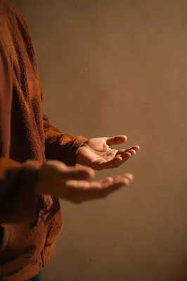 Open Hands in Warm Prayer Light