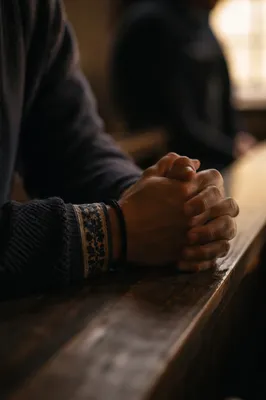 Hands Praying in Soft Indoor Light