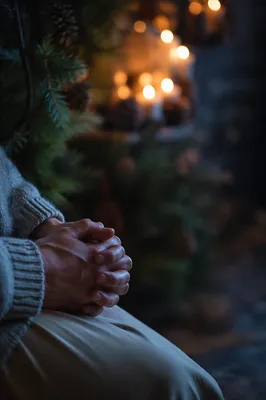 Praying Hands in Soft Evergreen Light