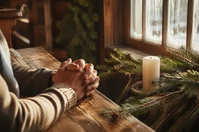 Praying Hands in Rustic Chapel Light