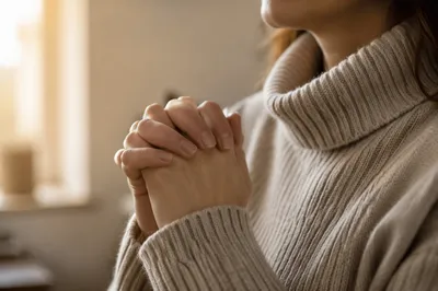 Peaceful Praying Hands in Soft Window Light