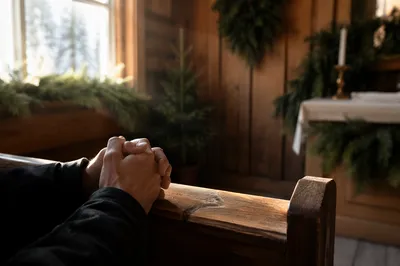 Praying Hands in Rustic Evergreen Chapel