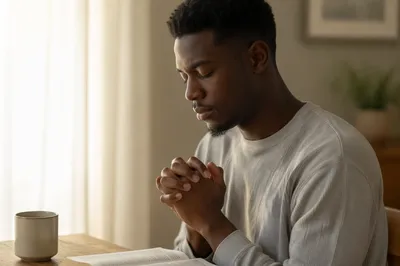 Young Man Praying by Window Light