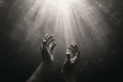 Hands Reaching Toward Hopeful Light