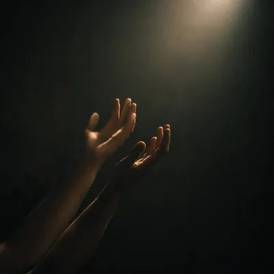 Hands Reaching Toward Warm Hopeful Light