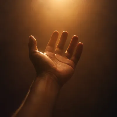 Open Hand Reaching Toward Hopeful Light