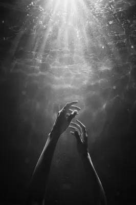 Hands Reaching Toward Radiant Hope