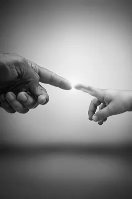 Hands Reaching Toward Hopeful Light