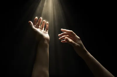 Hands Reaching Toward Divine Light