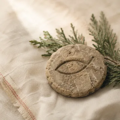 Carved Ichthys Stone with Evergreen Sprigs
