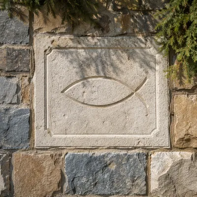 Carved Ichthys Symbol on Weathered Limestone
