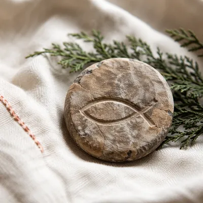 Carved Ichthys Stone on Linen