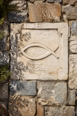 Carved Ichthys Symbol on Weathered Limestone